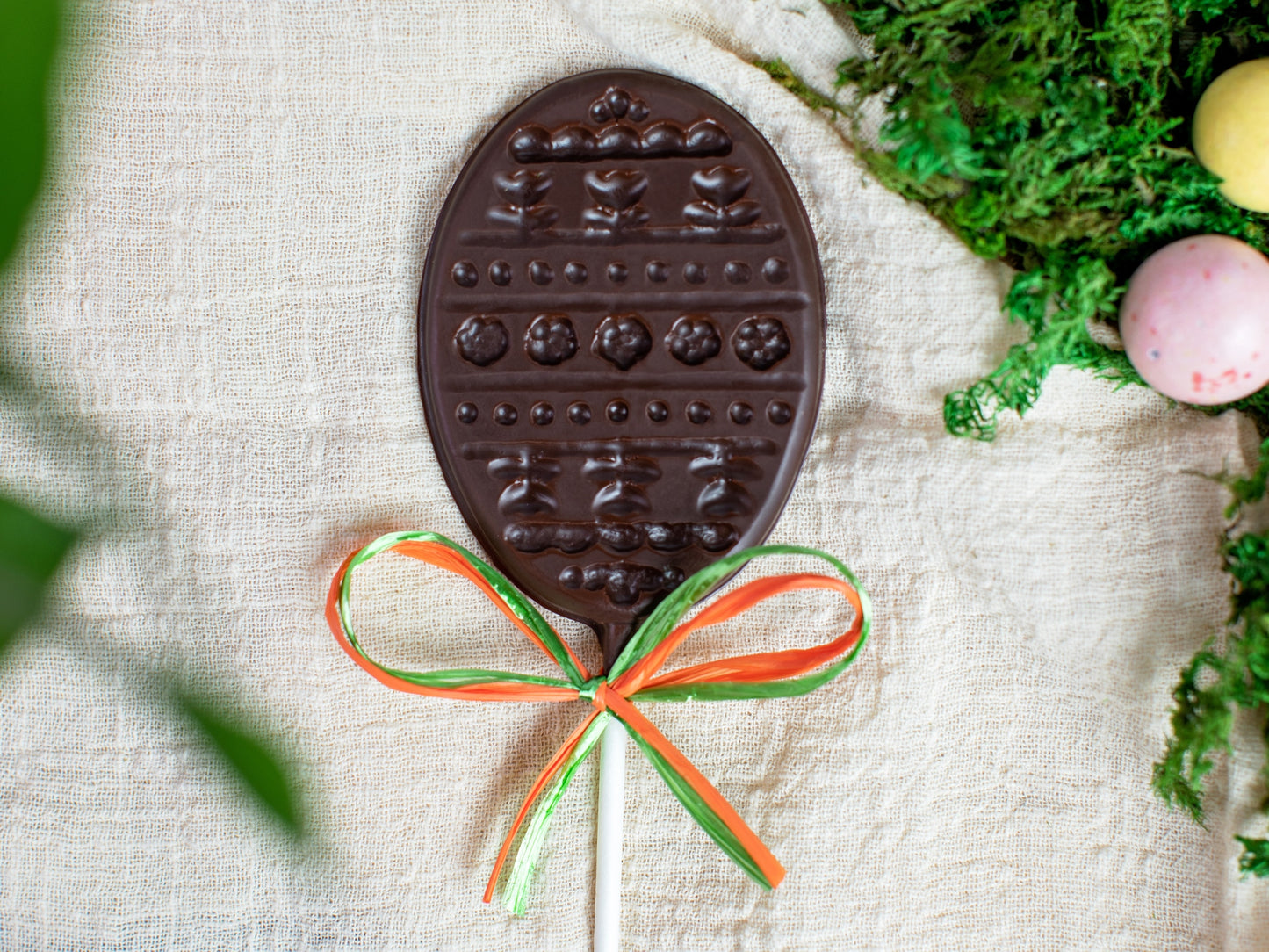 a chocolate pop in the shape of a decorated Easter Egg