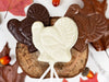 Three chocolate turkey pops in white, milk and dark chocolate artfully arranged